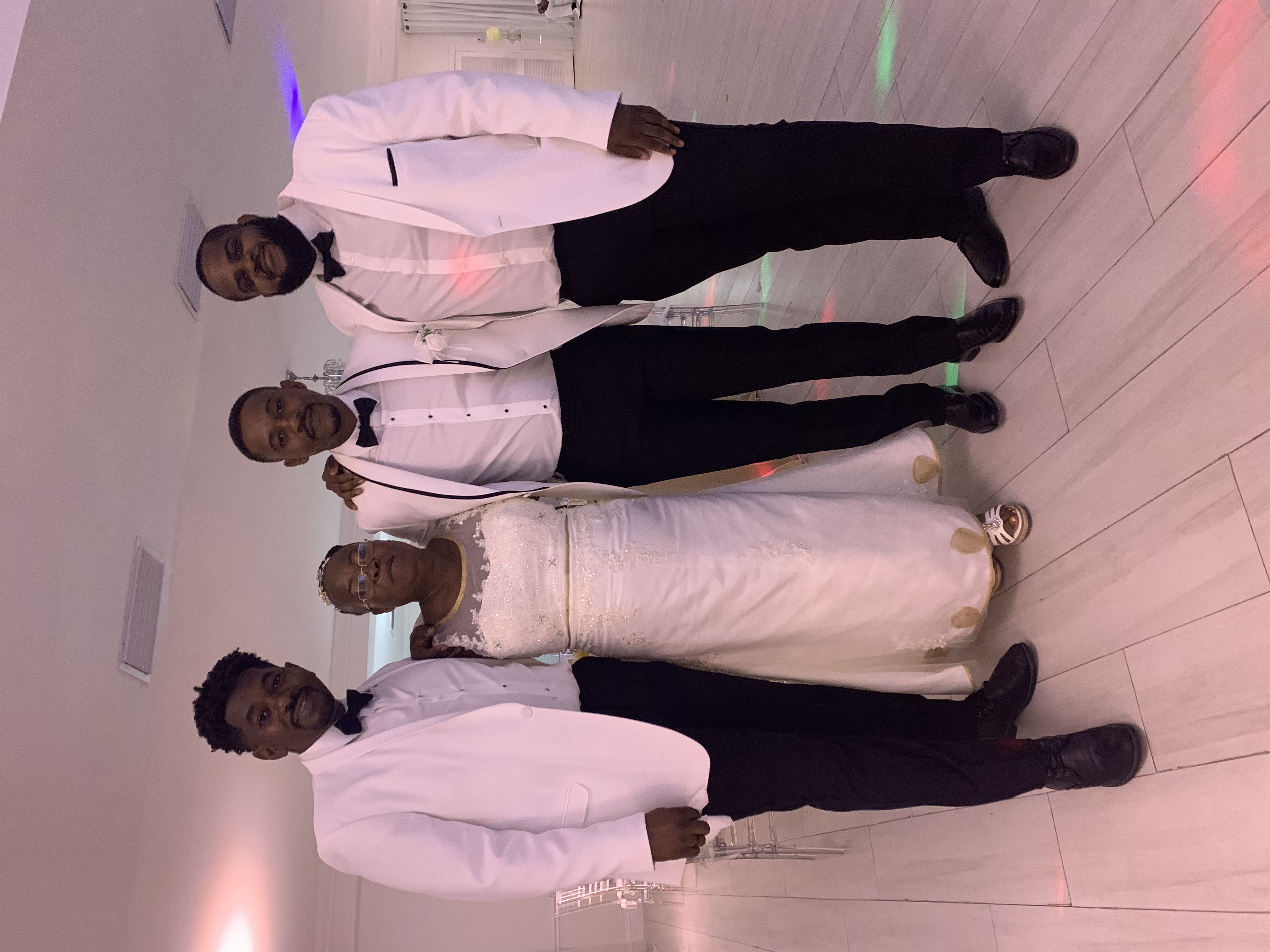 Rudy celebrating with family at a wedding